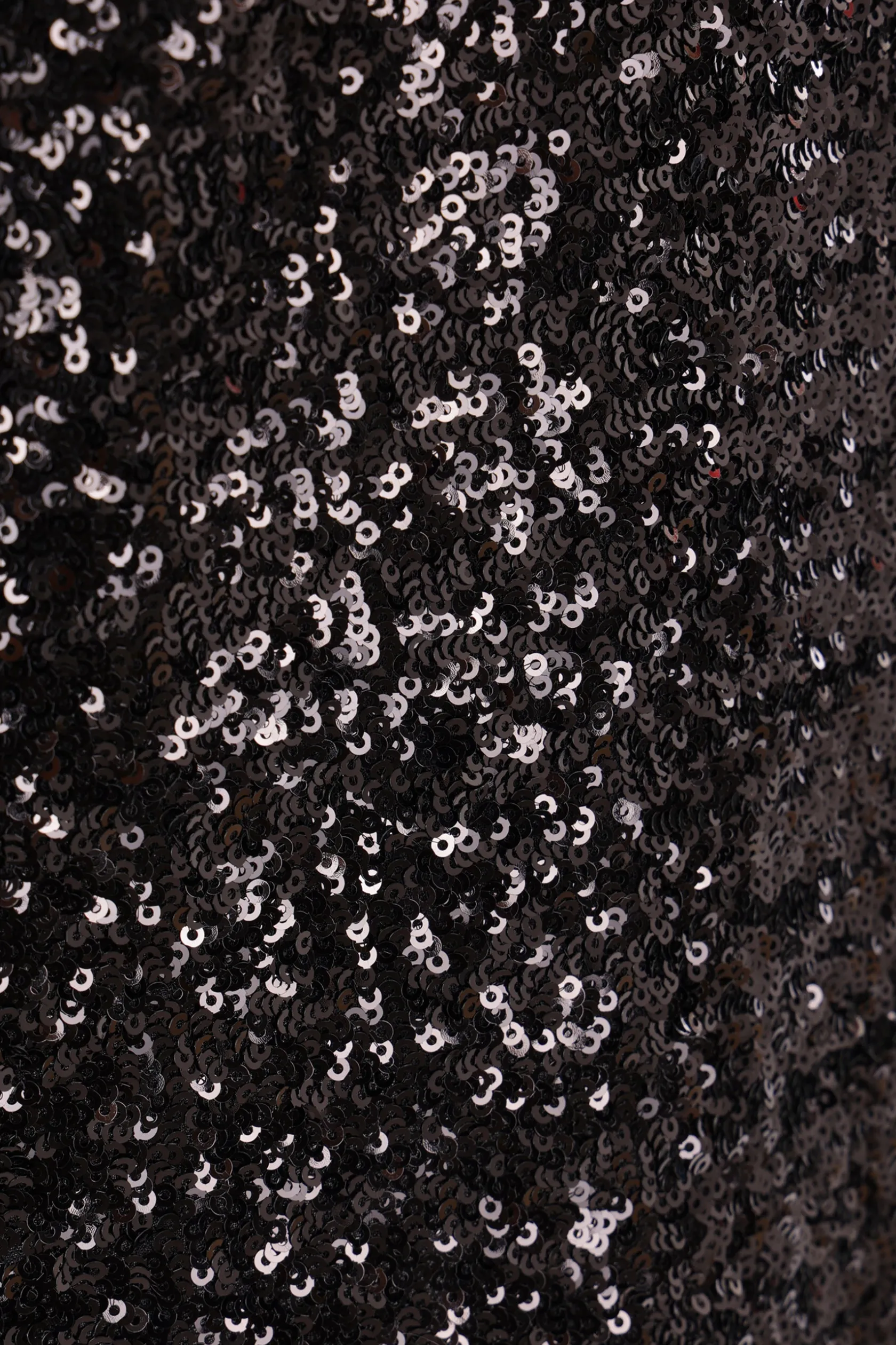 Topwear>COMME DES GARÇONS top smanicato in georgette con paillettes Nero
